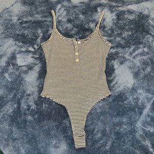 Garage, black and white stripped body suit, with buttons